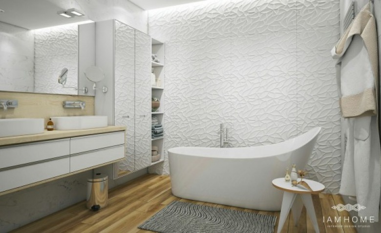 Strukturalne białe ściany, wolnostojąca wanna i nowoczesne szafki w łazience (26896)