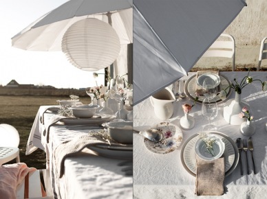 Letnia aranżacja stołu z parasolem na tarasie skandynawskim (28332)