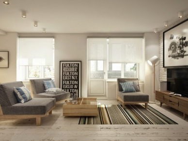 Deski podłogowe z naturalnbego drewna,biała cegła na ścianie,drewniane fotele z szarą tapicerką w tkaninie i tkany dywan w paski w salonie (26856)
