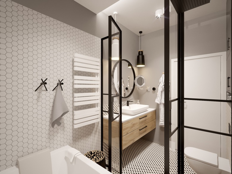Czarne elementy w łazience przesądzają o jej charakterze, który jest zdecydowany i łączy elegancję z funkcjonalnością. Tym, co urozmaica znacznie przestrzeń łazienki, są geometryczne kafelki na ścianie oraz na...