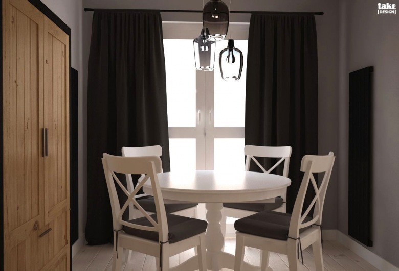 Okrągły stolik to zawsze dobra opcja szczególnie w mniejszych wnętrzach. Jadalniane meble pomalowane białą farbą...