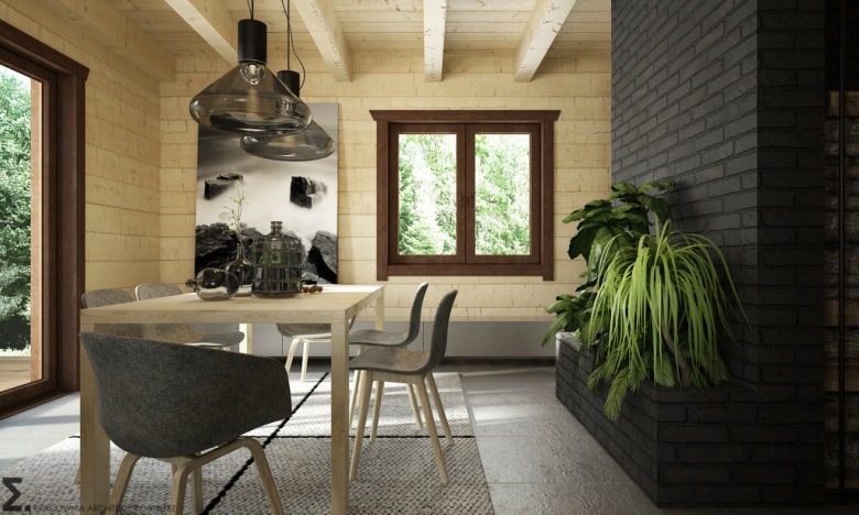 W jadalni nie tylko sufit, ale i pozostałe ściany wyłożone są jasnym drewnem. Naturalny materiał potęguje ciepło we...