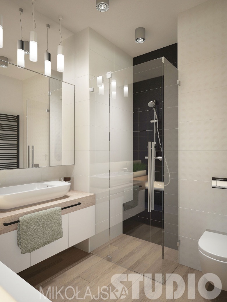 Aranżacja łazienki jest całkiem nowoczesna i schludna. Przezroczysta kabina prysznicowa podkreśla ten styl oraz spełnia...