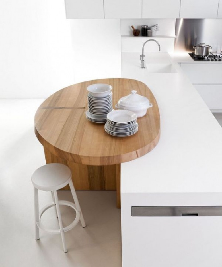 wspaniały i oryginalny projekt optymalnie urządzonej kuchni - idealnie biała z drewnianym, pomysłowym stołem - bardzo mi się podoba ten projekt, pomysł i styl...