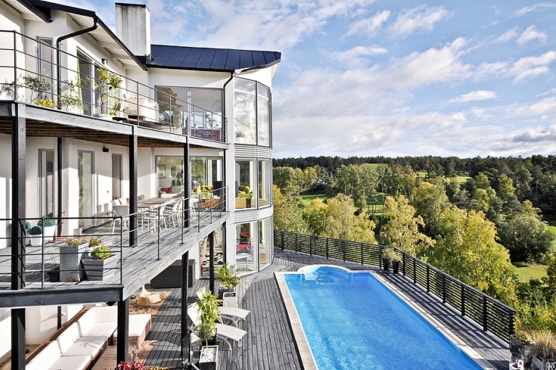Dom wielorodzinny z balkonami i basenem w stylu skandynawskim (23424)