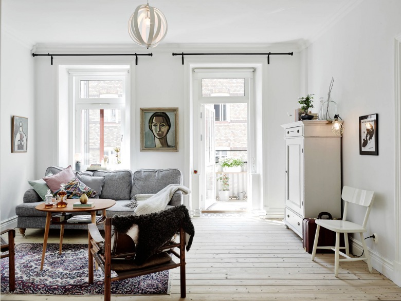 skandynawskie mieszkanie z nutą nostalgii i sztuką na ścianach - to ciepła aranżacja białego mieszkania z domieszką...