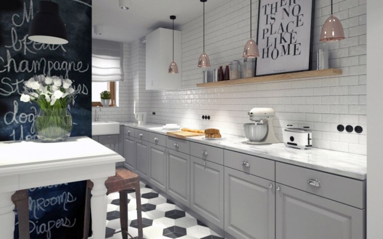 Biały blat pasuje świetnie do szarej kuchni. Farba tablicowa ożywia wnętrze. 