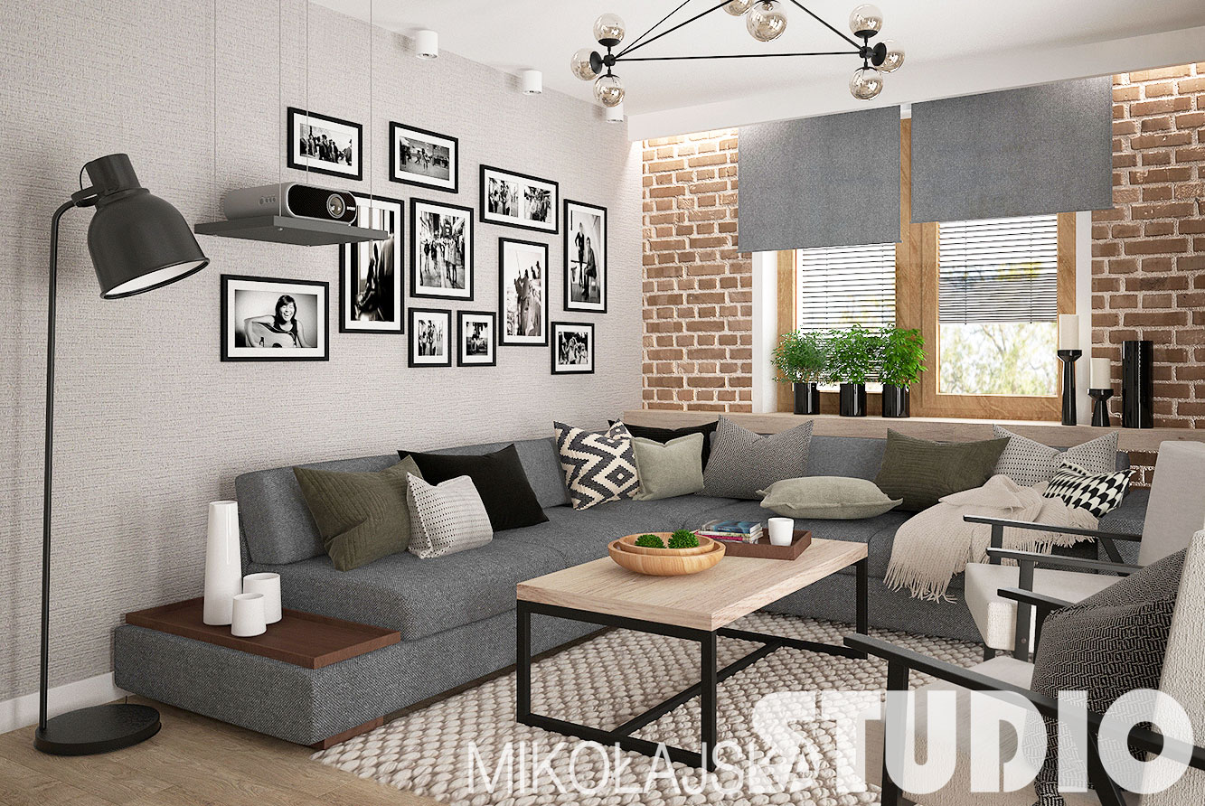 Krótszą ze ścian salonu wyłożono czerwonymi cegłami. Duża narożna sofa tworzy wygodne miejsce do wypoczynku i...